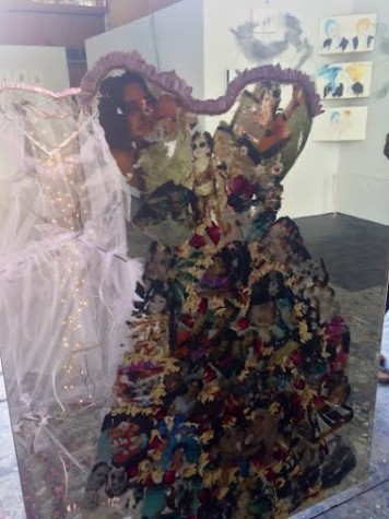 A metal dress with family photos attached welded by senior Olivia Black for her final project at Oxbow, based on ideas that had influenced her over time.