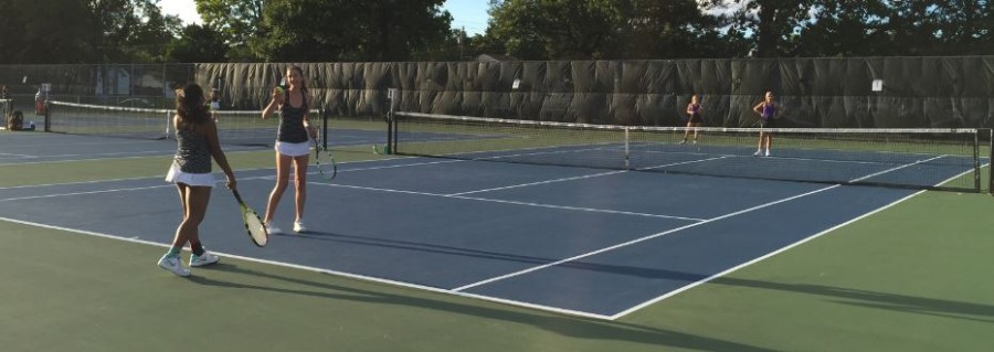 JUNIOR NINA PERLEBERG AND AMODHYA SAMARAKOON compete in a doubles match against Cretin Derham Hall on Sept 10. The young team provides a new team dynamic in comparision to previous years. “We have very similar teams in terms of our ability to play,” sophomore Isabel Brandtjen said.