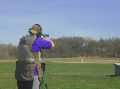 Freshman Riley Tietel takes aim at a clay pigeon during trap practice. "It’s just a great feeling,” Tietel said.