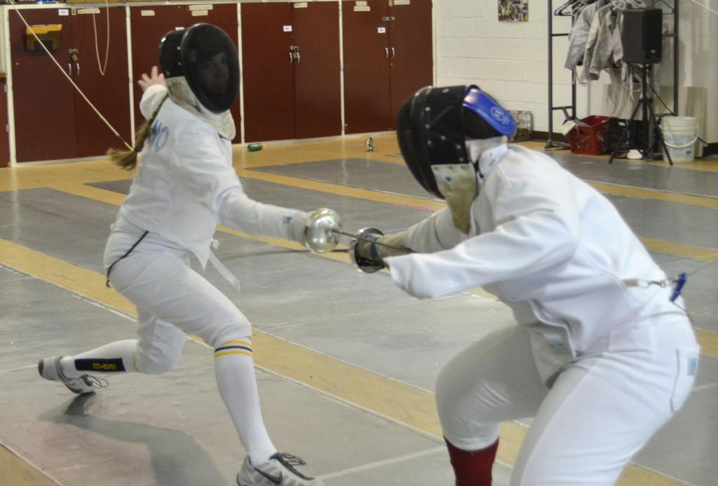 Senior captain Marie Siliciano lunged at an opponent at the Midwest Fencing Tournament in Culver, Indiana on Jan. 26.  “We do have a lot of seniors this year, so it’ll be a little tricky [next year].” Silicano said. 
