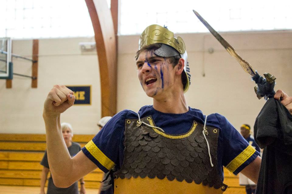 Spartan senior Connor Allen cheers during the Homecoming Pepfest on Sept. 27. “I am going to cheer better than any Spartan ever has or ever will,” he said. 