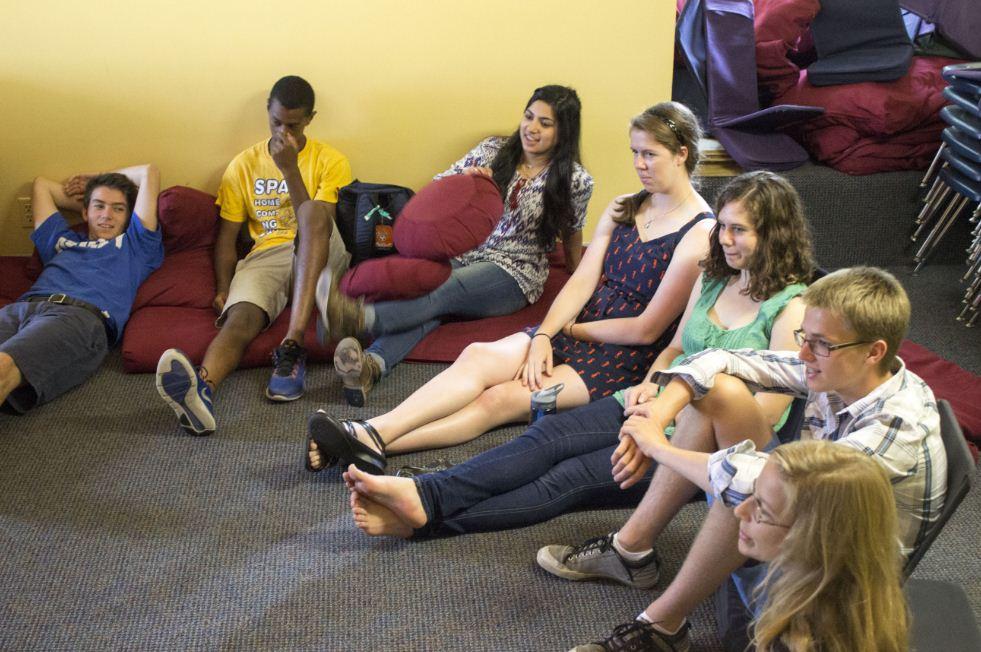 Senior peer helpers Marcus Alburez Myers, Emun Solomon, Yusra Murad, Katherine Jones, Sydney Kuller, Charlie Southwick, and Kaia Findlay settle down at the beginning of a Peer Helpers meeting. “If we’ve seen a problem in the community, we address it and talk about how we could help...,” Kuller said.