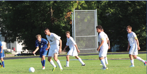 From left: Junior Sam Suzuki, freshman Drew O’Hern, junior Jordan Moradian and junior Tyler Seplak look for an open kick in their game
against Academy of Holy Angels on Sept.10. “Our goal is to really work hard playing together as a team,” junior captain Tyler Seplak said.