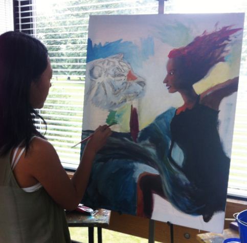 Senior Alicia Zhang works on her latest painting. “I’ve done it for so long that it kinda just became a habit… it’s just part of what I do,” she said.