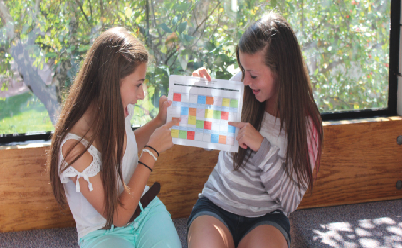 Sophomores Rachel Hotvedt and Liz Shaheen compare their schedules for the year. “My hope is for students and teachers to keep an open mind and keep talking about the things that work and the things that don’t,” Upper School Principal Chris Hughes said. 