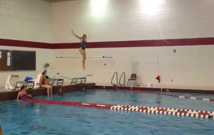 Junior Jackie Olson dives during practice