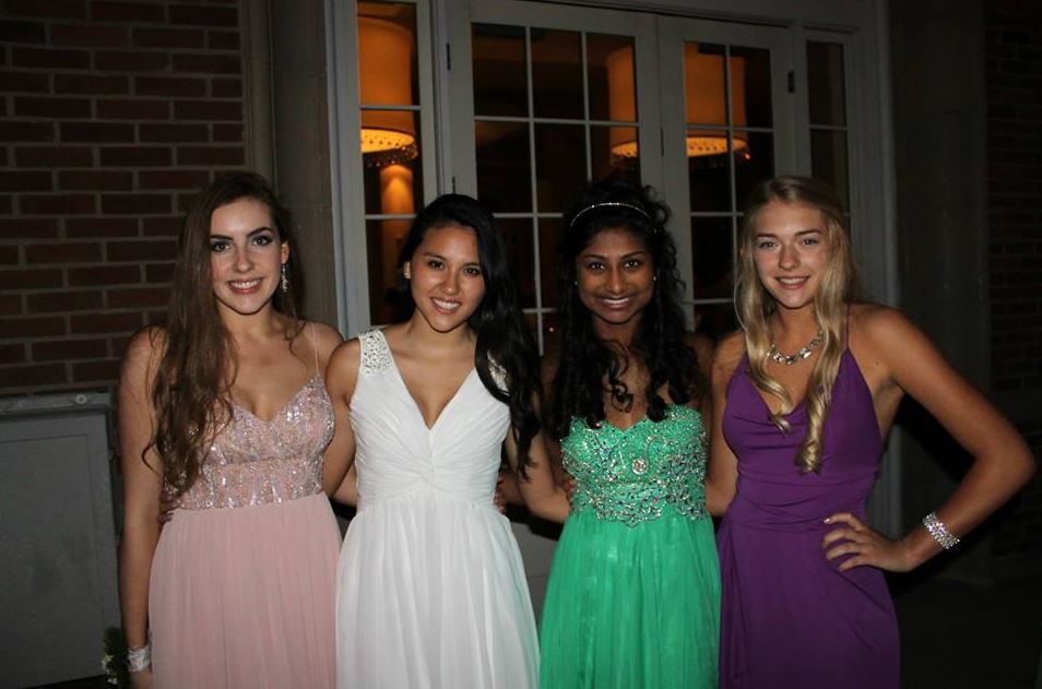 From left: Seniors Claire Foussard, Emma Chang, Sonya Das and Alida Mitau pose for a photo prom last year, held at the Lake Calhoun Beach Club in Minneapolis. Junior Class Leadership Council has already began looking into booking this years prom location. “We have just been focusing on locations because we want to get that booked first, junior JCLC member Aliza Rahman said. 