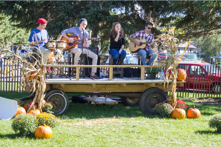 August Blues performs a song at the Spirit of the St. Croix Art Festival which took place on Sept. 28-29. “You have to keep the crowd engaged and happy,“ senior Dylan White, the band’s drummer, said. The band’s second album, Crossing the Blue, was released om Sept. 27.