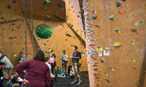 An instructor at Vertical Endeavors in St. Paul, the indoor rock climbing facility where freshman John Connelly practices, speaks to a group of children about youth programs. “What people don’t always realize is there’s a lot of strategy around [rock climbing],” Connelly said. 