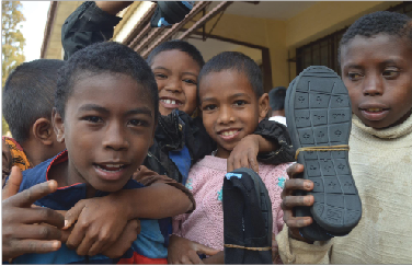 Children in Madagascar pose with their new TOMS® shoes, courtesy of the One for One program. “I think TOMS® are awesome. It’s nice to know there’s kids somewhere else looking stylish,” senior Frank Nahurski said.