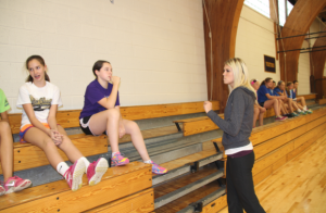 Upper School Physical Education  and seventh grade PE teacher Kaitlyn Frenchick separates her seventh grade class into teams to play handball.