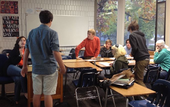 From left to right, Upper School history teacher and Quiz Bowl adviser Amy Weisgram, sophomore co-president Patrick Commers, freshman Cole Staples, freshman Ewan Lang, freshman Phoebe Pannier, freshman Cole Thompson, freshman Paul Watkins, and freshman Sarah Wheaton meet during Thursday X Period on Oct. 31. 