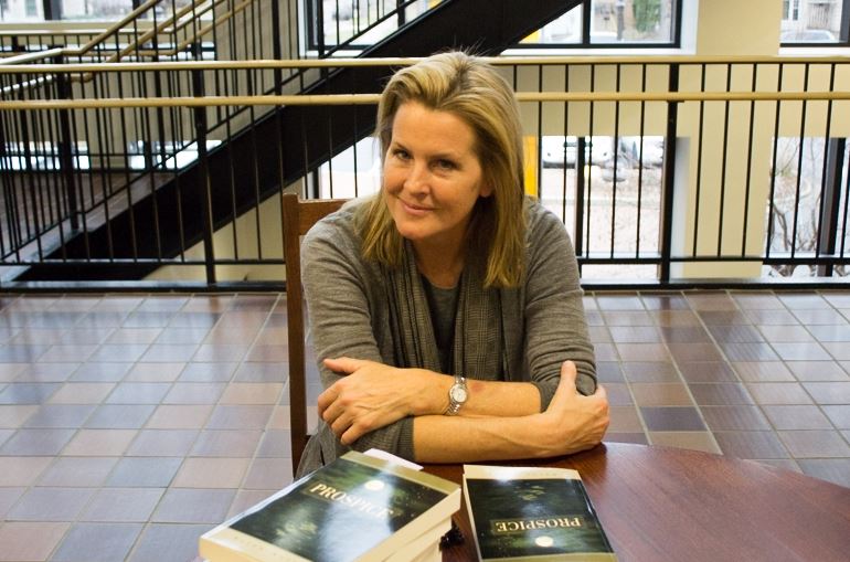 Author Karen Kelley sits at her book signing table on Nov. 21. I started to write because I needed a creative outlet, she said.