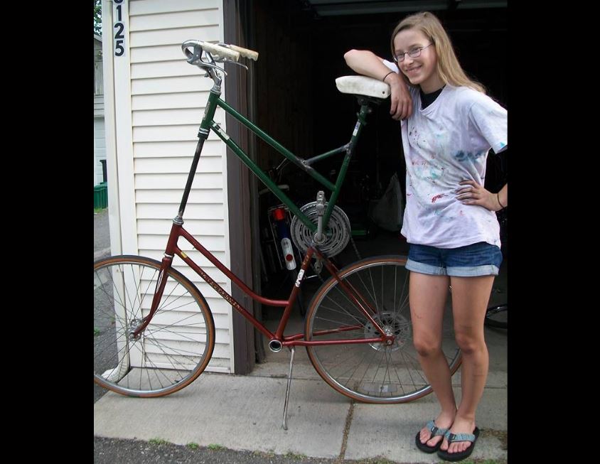 Senior Kaia Findlay poses next to the tall bike she built herself with help from her friends at the Grease Pit. “...A lot of people in my neighborhood had them so I thought, I want one of those,” she said.