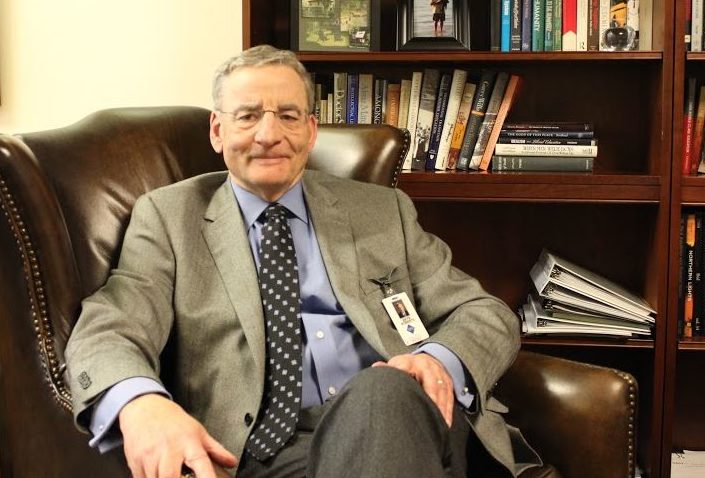 Head of School Bryn Roberts sits in his office. “What’s very different from today was that it was one size fits all,” he said about his high school experience.