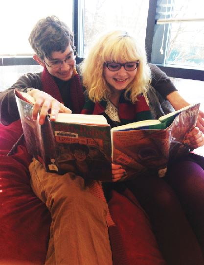 Freshmen Andrew Michel and Phoebe Pannier enjoy the Harry Potter book series in the Upper School Library. “I don’t think [Fantastic Beasts and Where to Find Them] will be as good as the other movies, but anything that J.K Rowling is writing will be great,” Pannier said. “Commercially, I think the movie will be a success since lots of people will go to the premeire. It will be beautiful. “ 