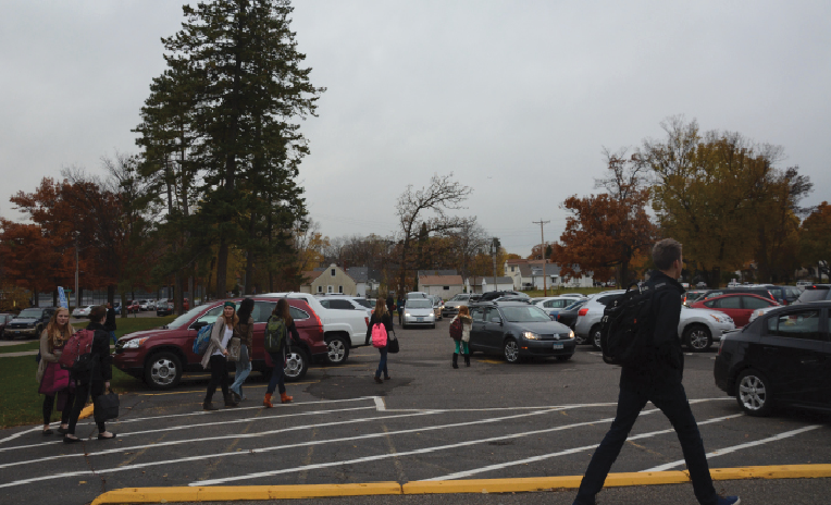 Upper school students walk towards their cars after school. “Most people, a good third [of our class], started taking [Driver’s Ed] classes freshman year. There were a couple stragglers that took it sophomore year,” senior Sarah Coleman said.