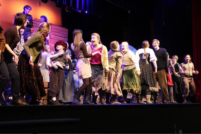 The cast of The Caucasian Chalk Circle warms up onstage by dancing to music. “Warm ups, for what we do, is to get everyone pumped up and energized,” junior Sophia Harrison said. “It gets us kind of in the mode. It’s kind of like a wake-up call, like ‘it’s show time!”’ she added.