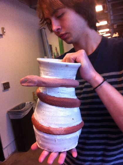 Senior Philip Swanson inspects his pot. “After you’ve thrown a pot… You can just admire it and think ‘I made this,’” Swanson said. “It’s one of a kind, and I brought it into existence.”