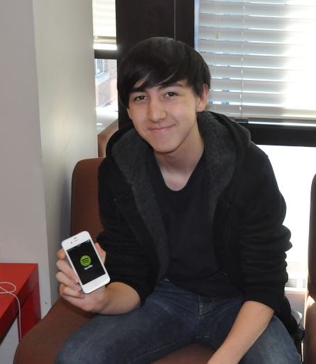 Sophomore Cole Fawcett holds up his phone, which has a Spotify app on it. "I use Spotify to listen to music while studying which makes me feel more productive,” Fawcett said.