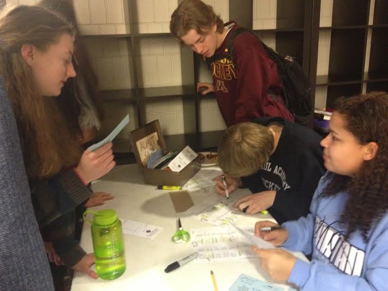 Lauren Woessner (left) purchases tickets from Student Activities Committee senior members (from middle to bottom right) Cal Nicholson,  Noah Parker, and Jonte Claiborne. “[The dance] gave me a chance to talk to people I normally don’t talk to, freshman Sonia Sukumar said. 