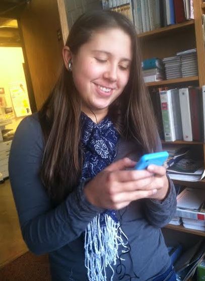 Senior Anna Matenaer looks up songs on her phone. “I think that Imagine Dragons should win Record of the Year [at the 56th Annual Grammy Awards],” she said