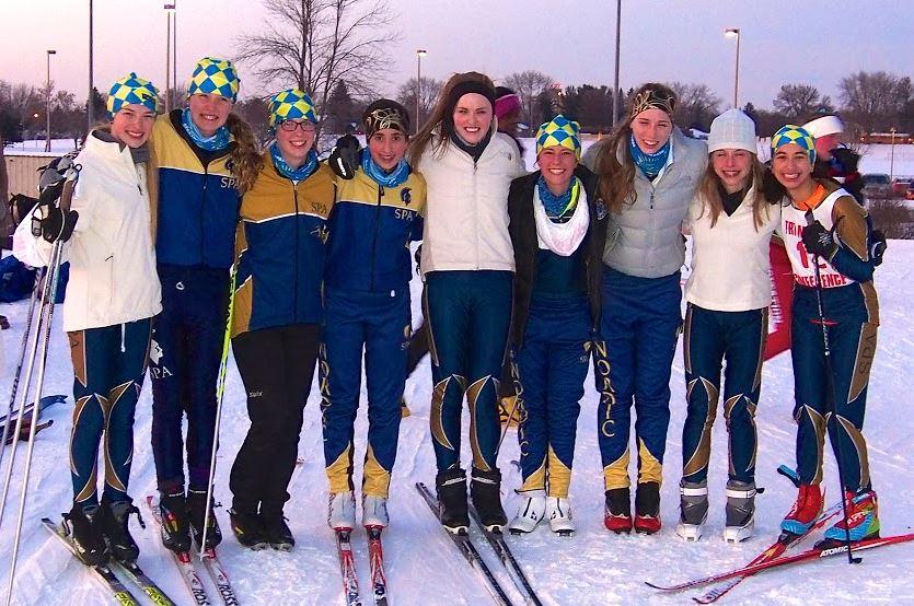 From left to right, sophomore Lexi Hilton, eighth grader Greta Sirek, senior Sela Patterson, eighth grader Dina Moradian, senior Katrina Hilton, eighth grader Val Hart, junior Ellen McCarthy, junior Mary Naas, and freshman Neeti Kulkarni attend a meet at Battle Creek. “I think we’ll still be strong this year,” Lexi Hilton said.