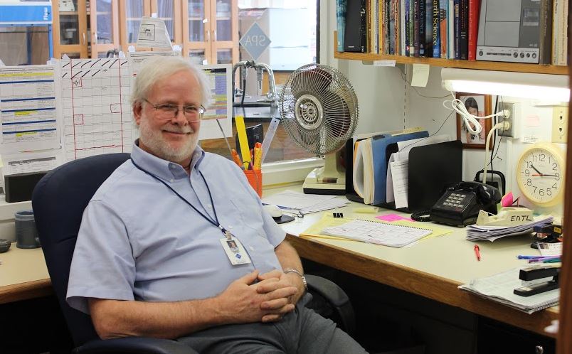 Upper School science teacher Dan Ertl sits in his office next to the Earth Science classroom. "Let's go back to the year 1968," he said.