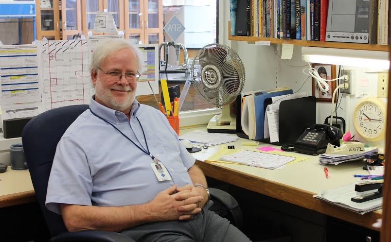 Upper School science teacher Dan Ertl sits in his office next to the Earth Science classroom. Lets go back to the year 1968, he said. 