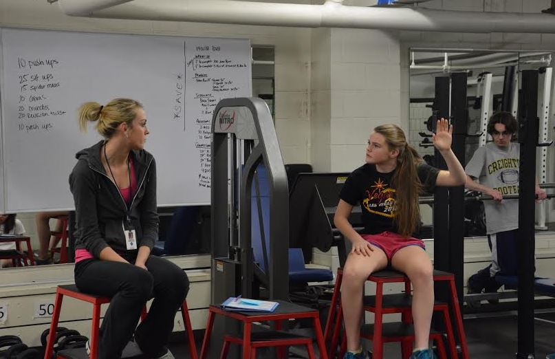 Freshman Lauren Hansen and freshman Cole Thompson attend Fitness for Life, taught by  Kaitlyn Frenchick (on left).  “I discuss what you should have in every meal, roughly how many calories you should have every day, and just understanding what a balanced diet and good eating habits are,” Frenchick said.