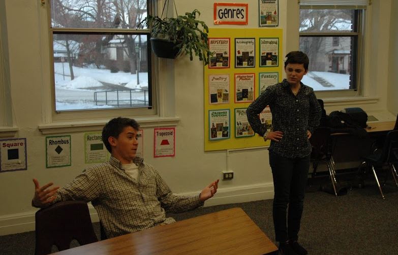 Senior Marcus Alburez (left) regales a disapproving waitress, played by sophomore Maggie Vlietstra (right), with a story about his ex-girlfriend who “went to Italy for a facelift and an abortion.” The Zig-Zag Woman is co-directed by the actors. 