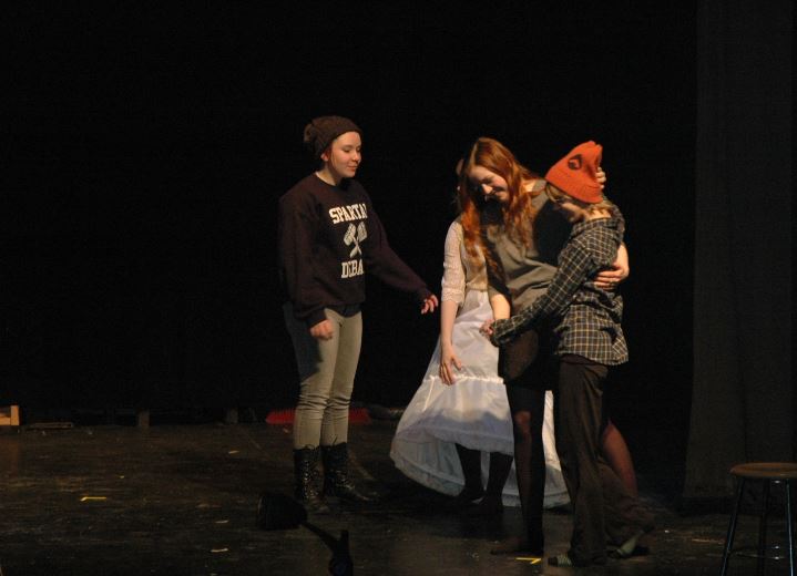 From left, freshman Isabelle Bukovsan, junior Sonja Mischke, and sophomore Maren Findlay warm up before rehearsing Molières Two Precious Maidens Ridiculed, directed by seniors Kaia Findlay and Helen Derechin.