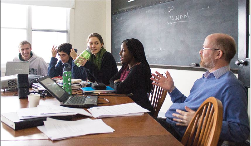 From left, seniors Harrisen Egly, Eduardo Flores, Charlotte Hughes, and Ysabella Johnson attend World Religions, taught by Upper School history teacher Ben Bollinger Danielson (right). The class regularly invites religious members and leaders to present to the class. “These speakers really do well to explain what being a part of their religions mean and how it affects them,”Bollinger Danielson said.