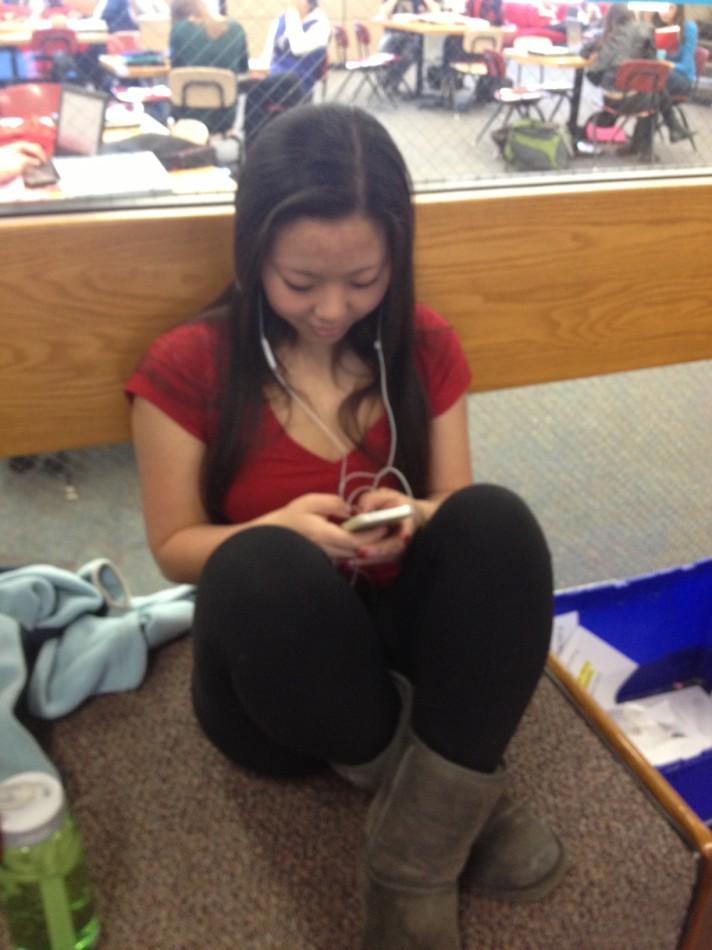 Senior Helen Derechin quietly uses her phone during a free period. “I like that it gives us access to communication with other people, especially if we need to contact our parents for some reason or to arrange after school plans,” she said.