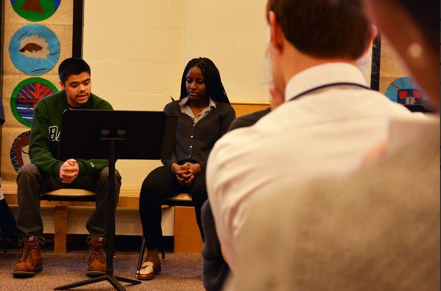 Senior Jared Mosher listens as fellow senior Ysabella Johnson tells her story of feeling suffocated by the social beauty expectations set by Barbie.