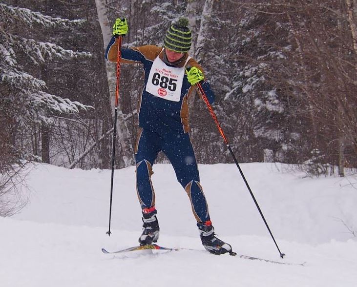 Junior captain Mike Destache races up a hill at Giants Ridge during the 2014 state meet. 