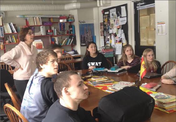 Spanish V classes prepare for the Language Exam.  From Left:  Karsten Runquist, Kent Hanson, US Spanish teacher Rafaela Salido, Lukas Kelsey-Friedman, Katie Ademite, Mary Naas, and Laura Viksnins review vocabulary.  “On the curve, we are really there with every other school,” Salido said.