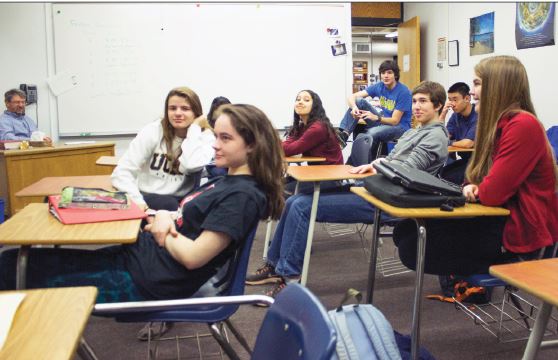 Members of math team listen to Upper School mathematics teacher Bill Boulger (not pictured) as he explains the upcoming competition. “As always, Mr. Boulger is absolutely incredible. He’s everything the Math Team could want and more,” senior captain Vittorio Orlandi said. 