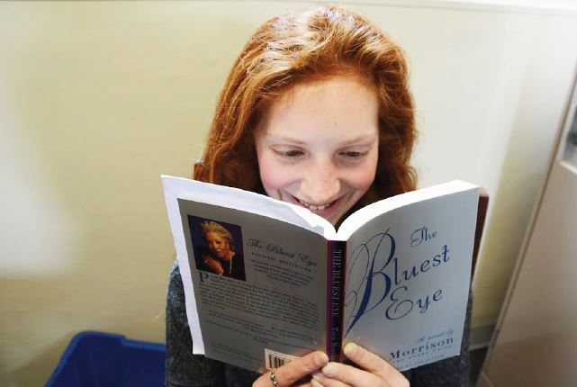 Senior Grace Owens-Kurtz reads The Bluest Eye, a book by Toni Morrison for her Gender and Literature English class. “[Reading]’s like when you were a kid, and you played pretend,” she said. “With a book, you can immerse yourself in the world you’ve always wanted.”