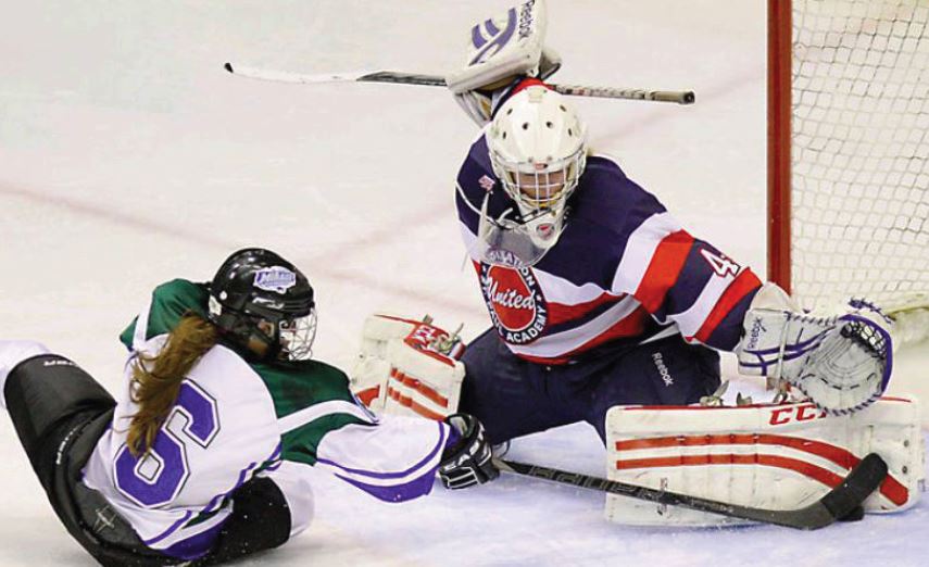 Sophomore goalie Catherine Johnson blocks a shot at the state quarterfinal game against Proctor-Hermantown. Johnson was named a member of the All-Tournament team. “It’s such an honor, especially to represent SPA and be the only one to be placed there,” she said.