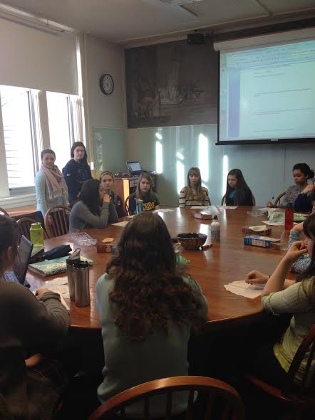  Students for Social Justice members lead a discussion about the dress code, led by presidents sophomores Alena Porter and Claire Walsh (standing on left). “We are working with [the Upper School Council] and a group of other [students] to change the dress code,” Porter said. 