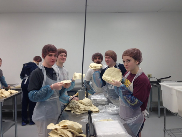 Sophomores from left  Will Donaldson, Cullen McCabe, Lexi Bottern, Brendan McGlincey, and Danish Mahmood sort and package fresh tortillas at Second Harvest Heartland in Golden Valley on Mar. 7. 
