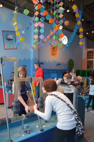 Senior Chloe White, left, volunteers at the Children's Museum for Service Day.