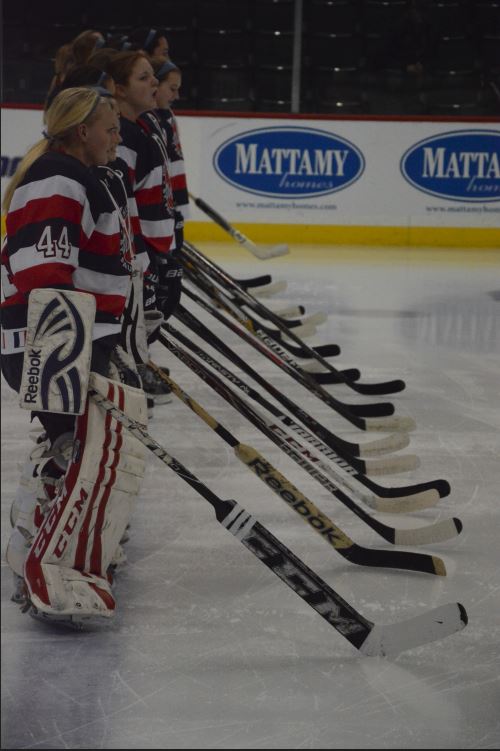 The United Hockey team, with sophomore goalie Catherine Johnson at the front, lines up to head into the semifinals of the Feb. 21 state tournament. 
