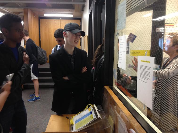 Sophomore Riley Wheaton, who won his run for chair of the Discipline Committee, examines the list of election results on April 23. "When I was first considering running I was kind of apprehensive about running as a sophomore," he said. 