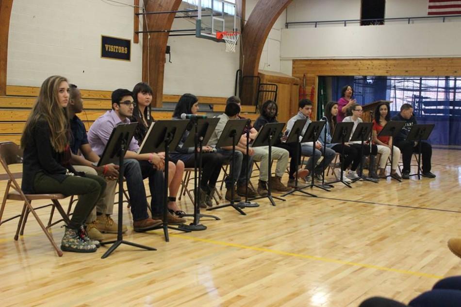 Common Ground members junior Emma Rodgerson, junior Dozie Nwaneri, junior Asad Masood, junior Isabella LaBlanc, senior Yusra Murad, senior Jared Mosher, senior Marcus Alburez Myers, senior Ysabella Johnson, junior Jesus Vega, junior Bella Martinez, senior Ellis Evans, junior Mansuda Arora, and senior Sam Carlson share stories of identity at an assembly on April 15. The group is advised by Diversity Dean Karen Dye. 