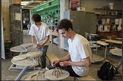 Seniors Connor Allen and Philip Swanson enjoy making new sculptures in the senior art seminar class.  