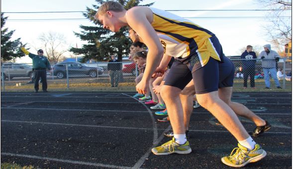 Sophomore Shaymus OBrien prepares to run at the starting line in the first track meet of the season April 8 at Corcordia Academy.  Theres definitely that [community] atmosphere and everyone knows whats going on with each other,freshman Neeti Kulkarni said. 