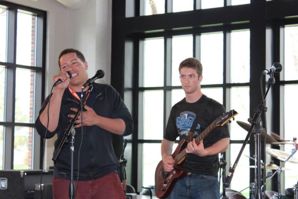 Senior Sam Carlson sings with senior Nick Cohen on guitar at this years Battle of the Bands.