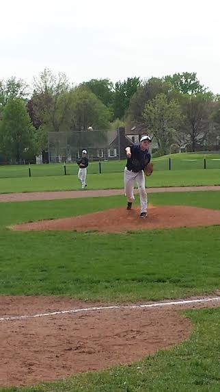 Freshman Emerson Egly delivers a pitch in a May 24 section game against Edison High School. "there are small things we need to improve on but overall it was a good day for us," Egly said.